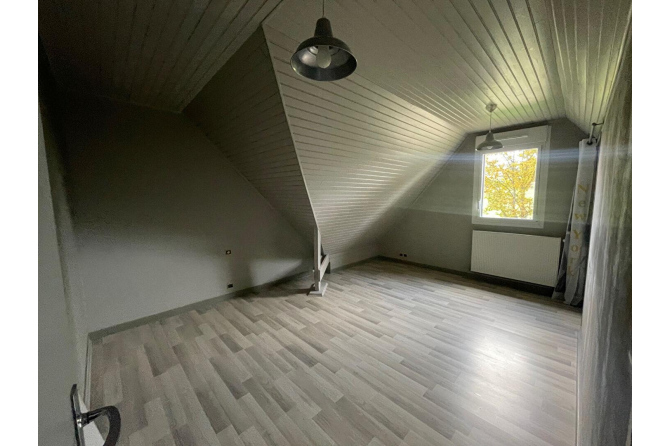 Maison à Pontmain au bord d'une rivière